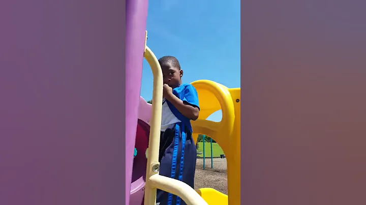 Jordan trying  to cross the monkey bars