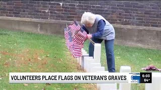 ‘That’s something I can do': Volunteers place flags on graves to honor veterans