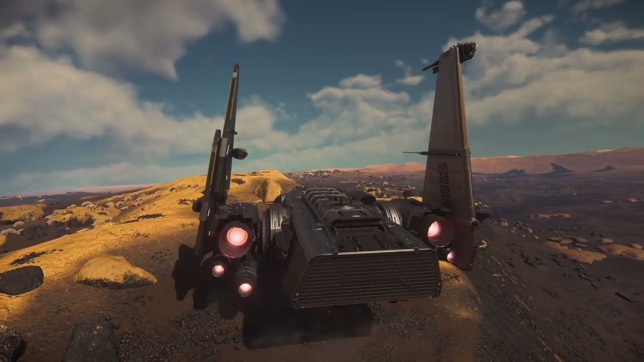 A ship parked in a desert under a blue sky, a still from one of the videos