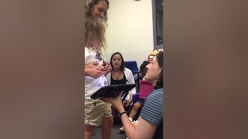 Use of an augmentative communication device to help communication