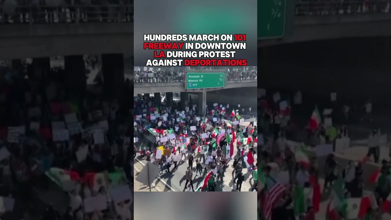 Hundreds march on 101 Freeway in downtown Los Angeles during protest against deportations