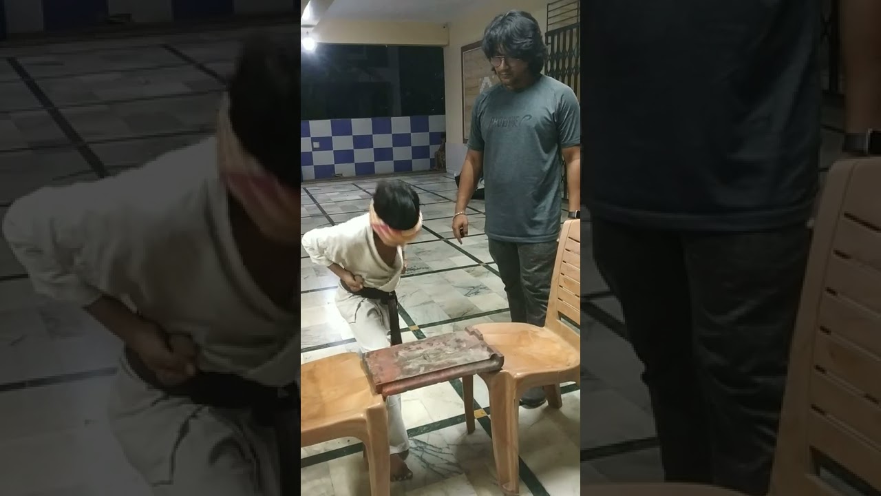 Me breaking a mud tile with my head