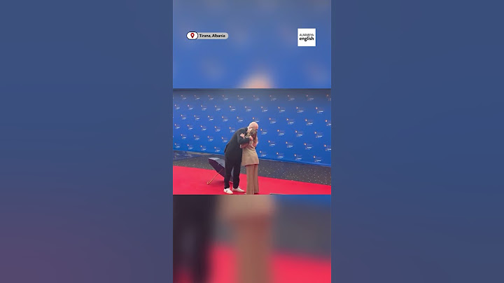 Albania’s PM kneels to greet Italy’s Meloni