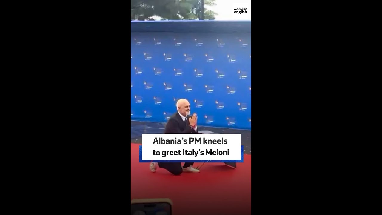 Albania’s PM kneels to greet Italy’s Meloni