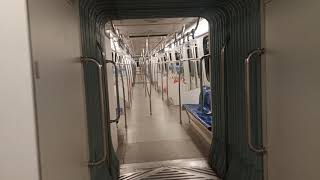 Walking inside moving empty Putra LRT Train
