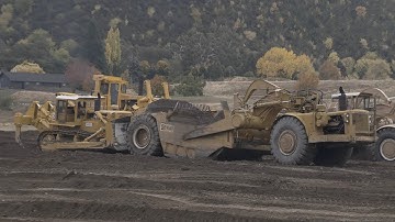 Caterpillar D9G Bulldozer pushing a CAT 641 Scraper