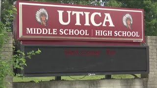 Ohio school district settles $150K lawsuit after student wiped visor with US flag