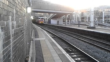 DB 67018 TnT 67005 departs London Euston with the 