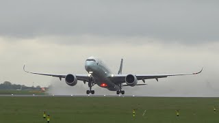 Cathay Pacific A350 B-LQC departs with lots of spray