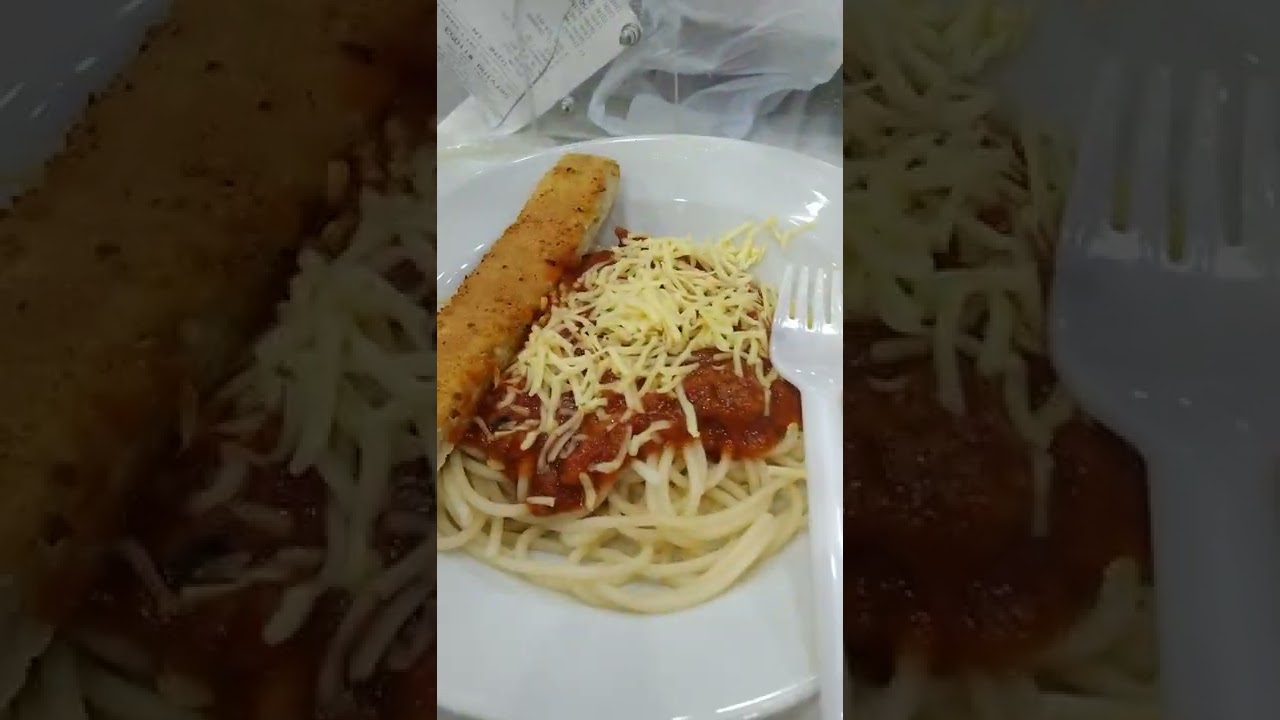 HAPPY KID ENJOY EATING GREENWICH MEATY SPAGHETTI WITH BREAD STICK 