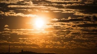 Dramatic Sunset Over the Storm Clouds and Over Trees and Pipes of the Plant. Time Lapse | Stock