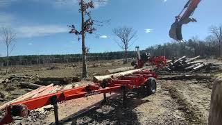 Kubota Kx057-5 and Woodmizer lt28 making cedar split rail fence