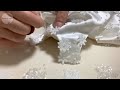 Making a white floral baby dress. process of making a dress.