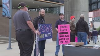 Patients, Medicare advocates protest outside Humana building