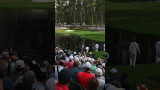 Masters caddies having fun skipping balls onto green at Augusta National.