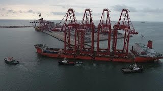 Giant cranes undocking at the port of Pointe-Noire in Congo [no comment]