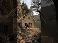 Hidden stone house built on a cliff deep in nature