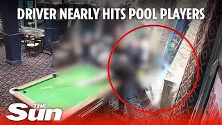 Driver CRASHES into pub nearly hitting pool players during high-speed police pursuit