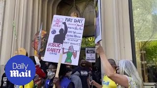 May Day protesters demonstrate outside Amazon boss Jeff Bezos' apartment in New York