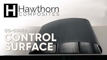 Co-Cured Wing Structure Using Dry Carbon Fiber Application/Overbraiding & Resin Transfer Molding