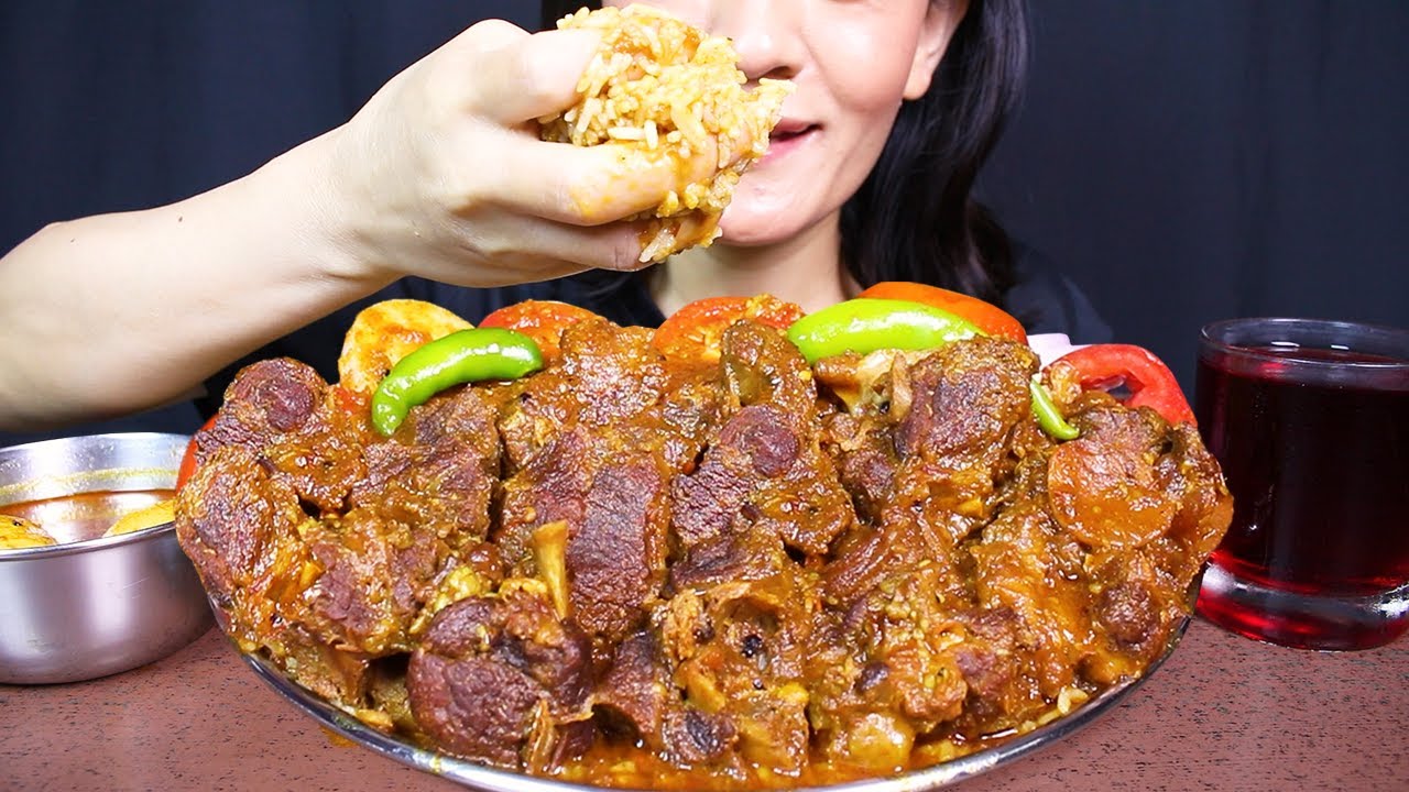 Eating Spicy Delicious Mutton Curry/gravy with Basmati Rice, Tomato 