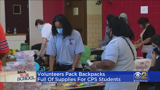 Volunteers Pack Backpacks Full Of Supplies For CPS Students
