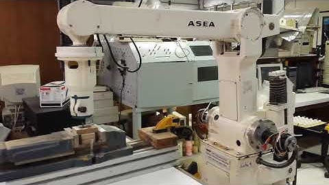 STEP-NC Architectures for Industrial Robotic Machining: Review, Implementation and Validation