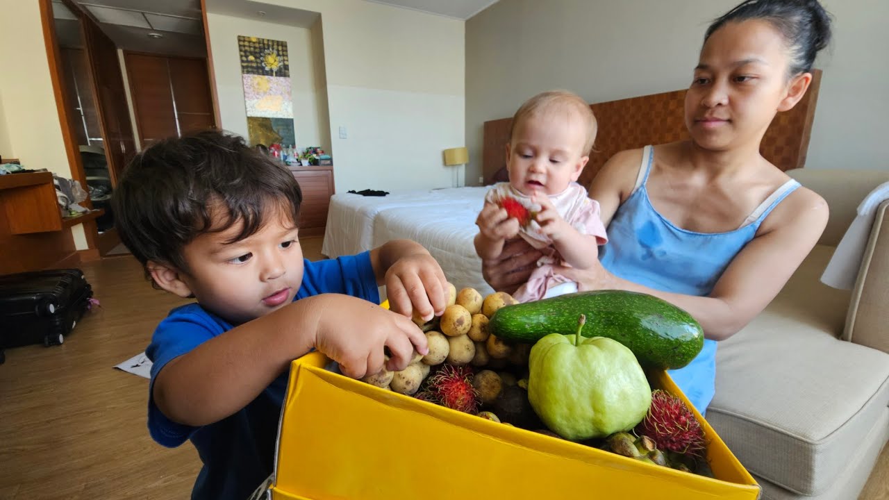 Baby and big brother trying exotic fruit for the first time! 👶🍌🍉 