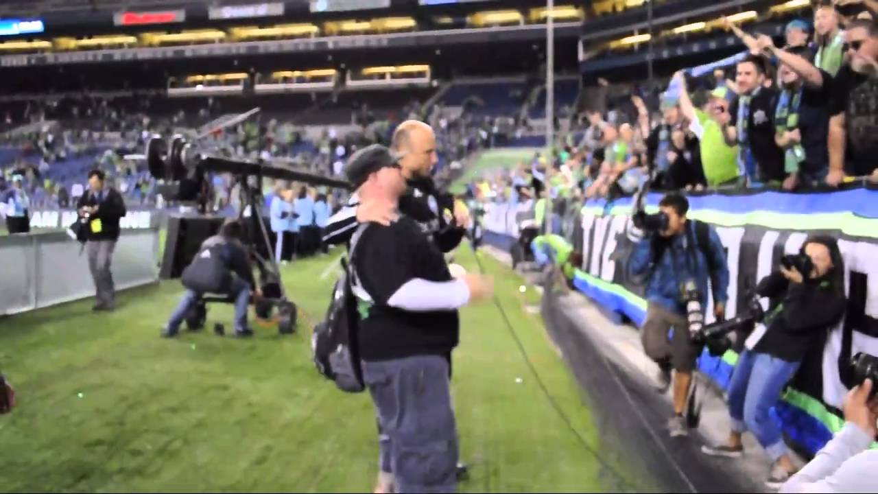 Kasey Keller sings with the Emerald City Supporters