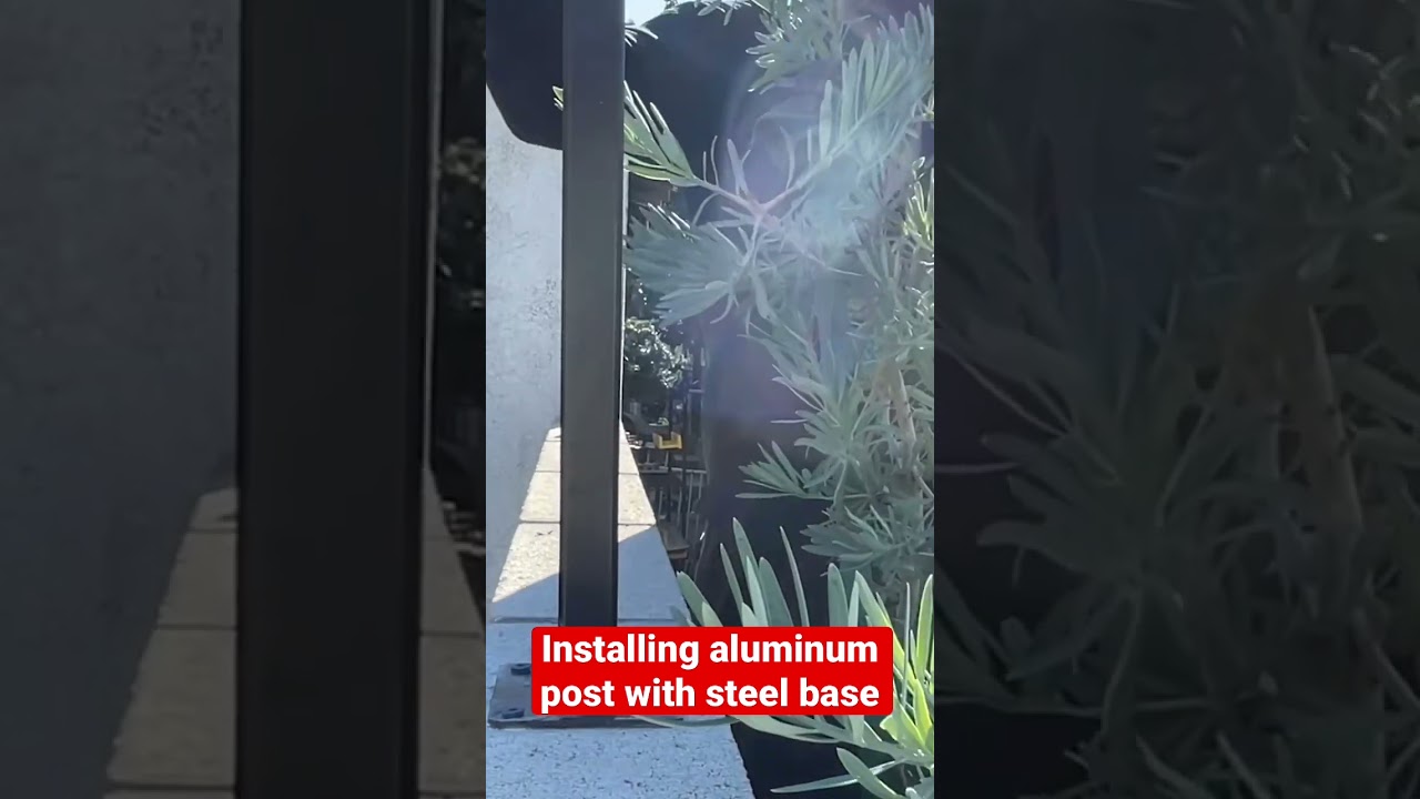 Aluminum fence on top of concrete block wall 