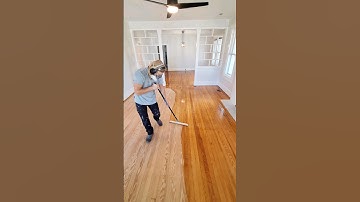 Restoring original hardwood floors by sanding and applying polyurethane (applicator link in bio)