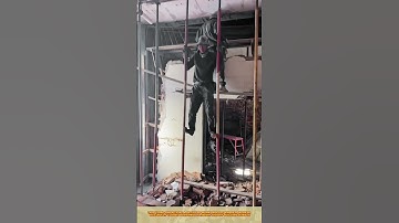 Skilled Worker Climbing Down from a Height on a Demolition Site #workprocess