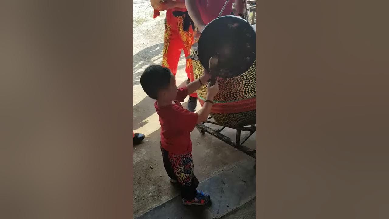 CNY lion dance performance - playing gong