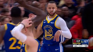 Stephen Curry dances for the Raptors bench after scoring an acrobatic layup at the end of the game