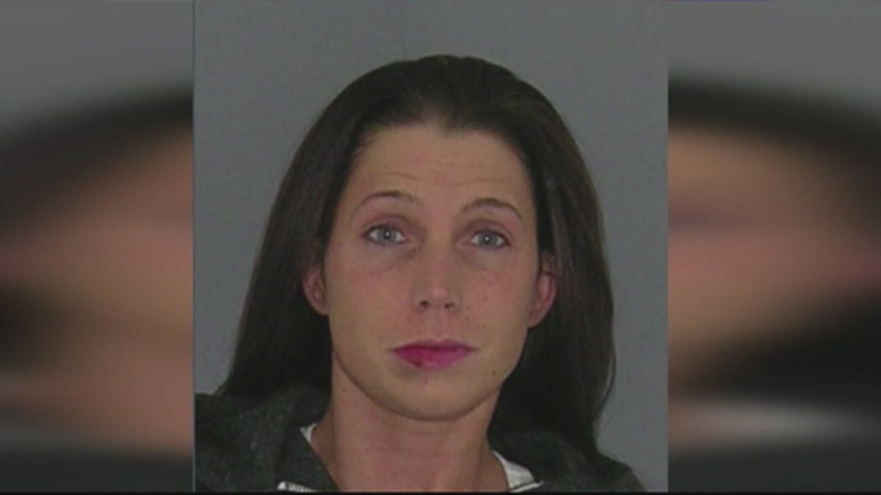 Mom gives boy sippy cup of wine to hold