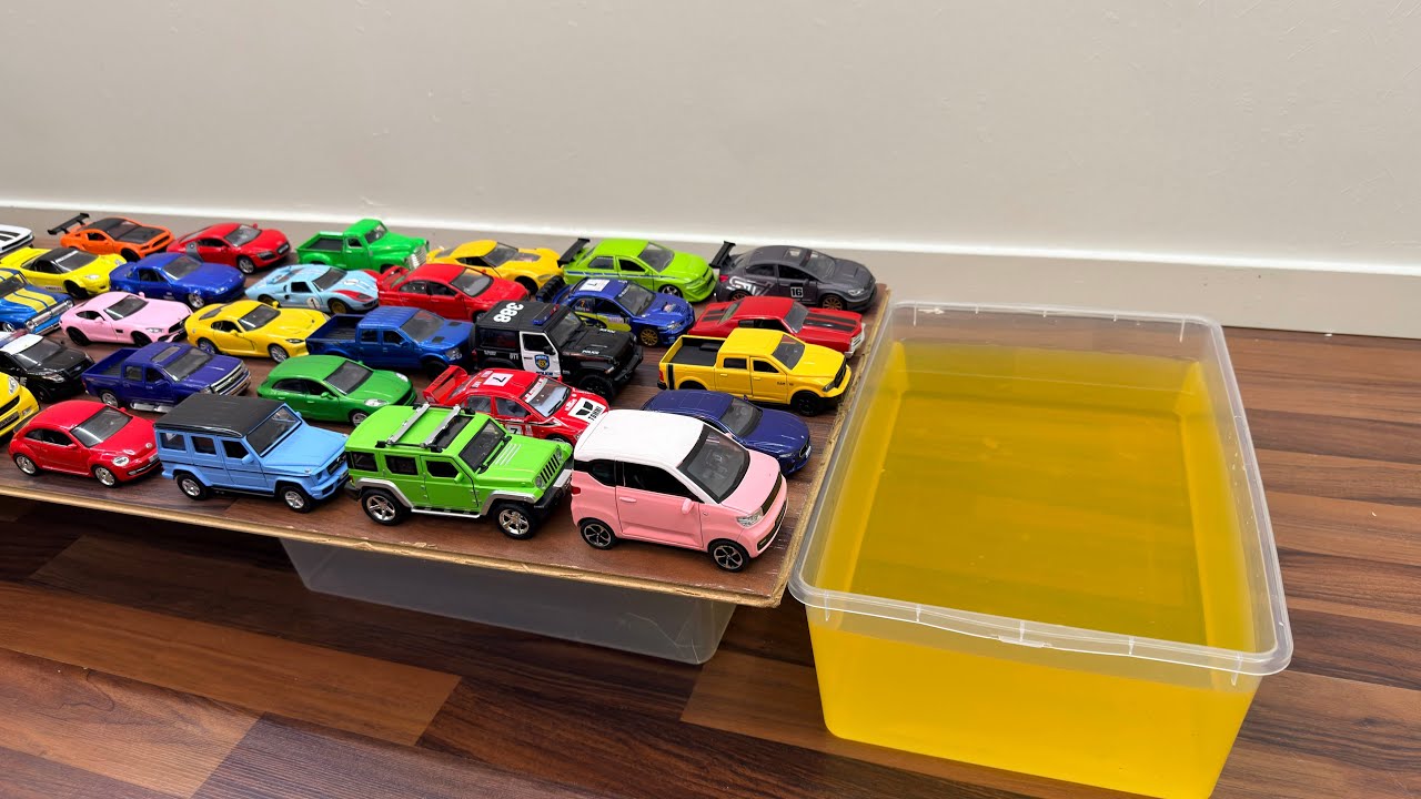 Pullback Toy Cars And Let Go Into The Yellow Water
