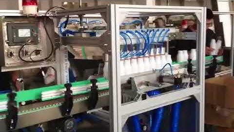 High speed and high capacity leak tester for plastic bottle