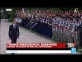 Macron inspects the Republican guard, under the sound of La Marseillaise and a 21-gun salute