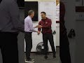 Mark Coyle Presents Coach May With First Win Game Puck