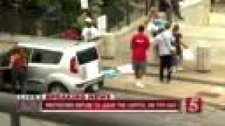 Troopers remove donated items from protest area at Capitol