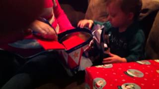 Logan opening gifts at Christmas 2011