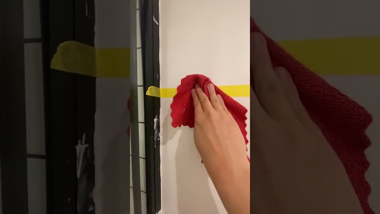 Monochrome bathroom transformation with bold black blocks 