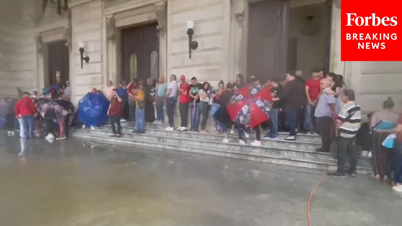 Hurricane Idalia Causes Heavy Rainfall In Cuba, Soaking People Waiting At Spain Consulate