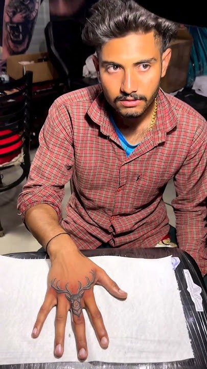  finger deer tattoo / finger tattoo designs men