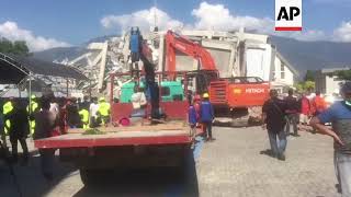 Rescue workers continue to retrieve survivors in Indonesia