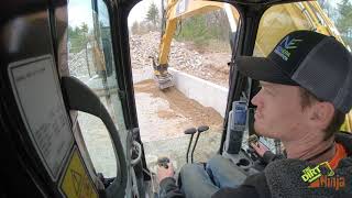 Cat 316F and Engcon Tiltrotator Backfilling Garage