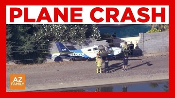 Plane crashes into brick wall near canal in Mesa