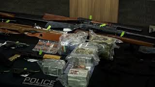 Weather Eight charged, 18 firearms seized in organized crime investigation Station Image
