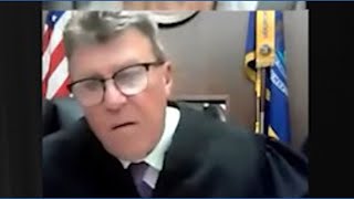 Judge calls out woman driving during hearing