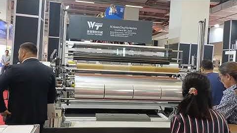 Three layer stretch film machine with automatic paper core loading &unloading system ;